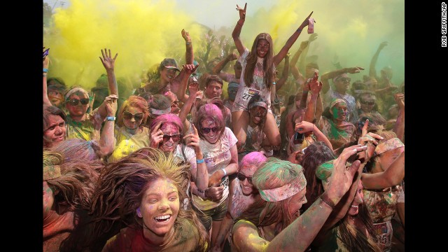 <strong>February 10:</strong> People celebrate in clouds of colored dust after the Color Run 5K in Sydney.