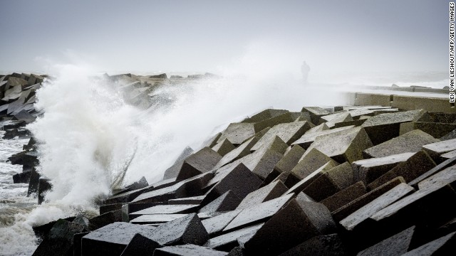 A person walks along a dike December 5 in Scheveningen, Netherlands.