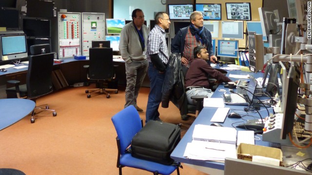 Physicists in the CMS control room. Although the particle accelerator is shut down until 2015, this is a busy time for everyone involved in upgrading the particle detectors and analyzing data from the first run of particle collisions. 