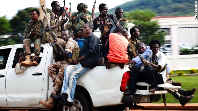 Seleka soldiers race through Bangui as gunfire and mortar rounds erupt in the capital December 5.