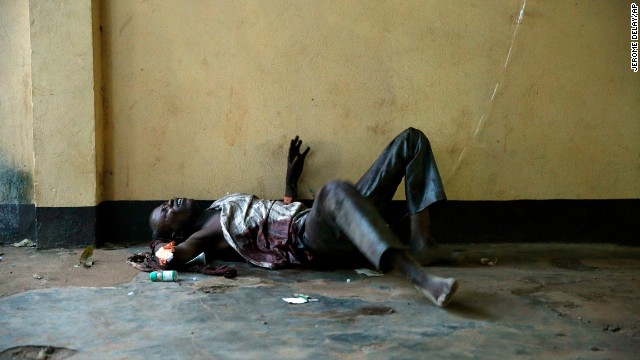 A severely wounded man lies unattended in a Bangui mosque December 5.