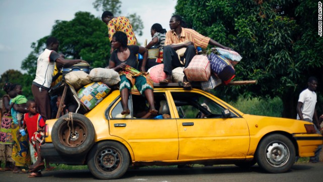 Christians from the village of Bouebou load up on a taxi as they flee violence on December 4.