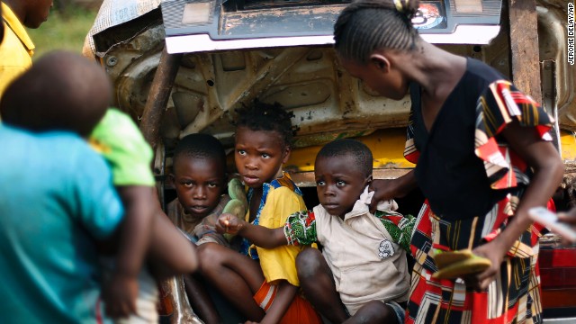 Christian children from Bouebou are packed in the trunk of a taxi as they flee violence December 4. 