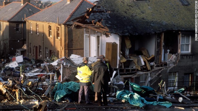 Investigators confer at the crash site two days after the tragedy. In July 1990, the British Civil Aviation Authority's Air Investigation Branch officially reported that an explosive device caused the crash.