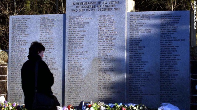 On the 10th anniversary of the bombing, a woman pays her respects in the Garden of Remembrance at Dryfesdale Cemetery in Lockerbie.