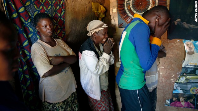 People grieve for a man killed in Bangui on December 7.