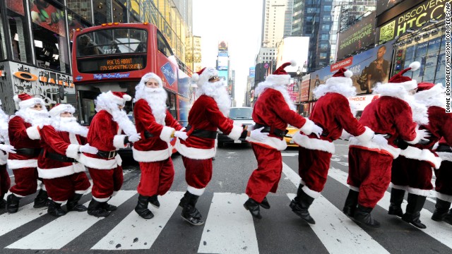 Santa Clauses bunny-hop through Times Square as they deliver holiday Peeps and spread cheer on December 4.