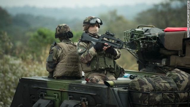 French soldiers patrol on a road in Baoro on December 7 as part of the military operation aiming at restoring security in the Central African Republic.