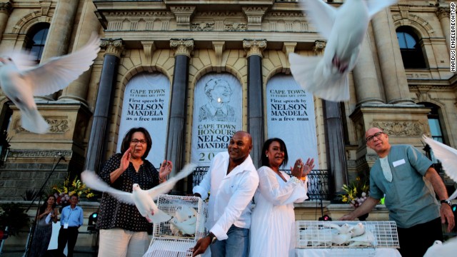 Doves are released for Mandela at the Grand Parade in Cape Town, South Africa, on December 8.