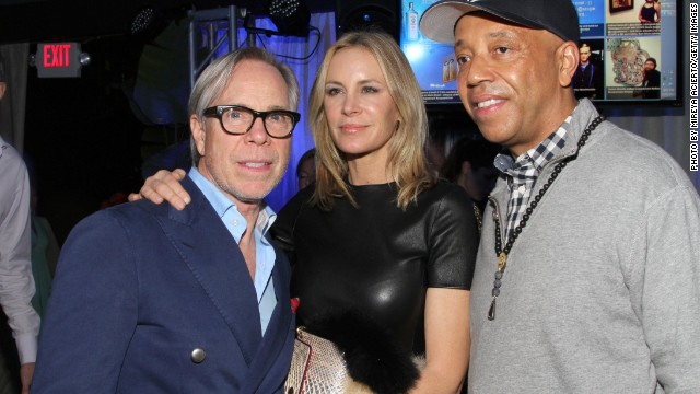 In 2011 fashion designer Tommy Hilfiger acquired a Damien Hirst work entitled "Disintegration -- The Crown of Life" for $1.4 million. Here Hilfiger and his wife mingle with Russell Simmons at an Art Basel event hosted by Bombay Sapphire.