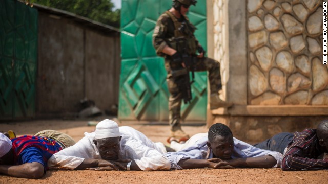 A French soldier stands guard after the arrest of ex-Seleka rebels in a neighborhood near Bangui's airport on December 9.