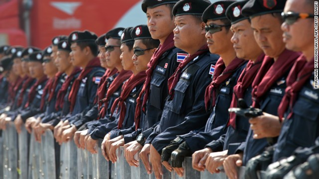 Thai riot police stand guard during a demonstration in Bangkok on December 10.