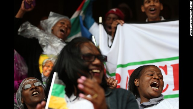 People sing and dance at Ellis Park in Johannesburg.