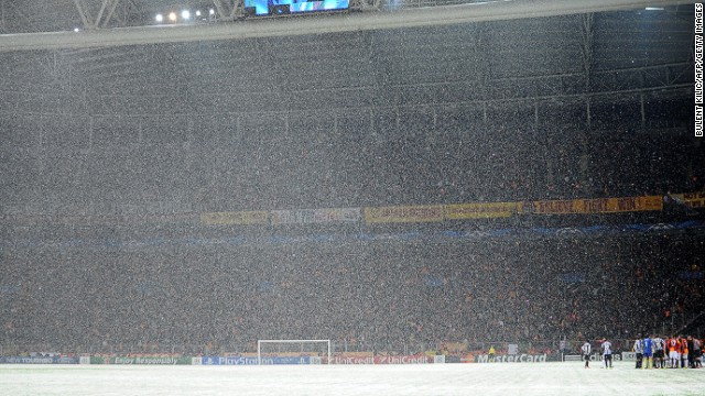 Snow teaming down at the Turk Telekom Arena in Istanbul on Tuesday night. Despite the best efforts of ground staff to make the pitch playable, the game was eventually abandoned. UEFA say the match will resume at 12pm GMT on Wednesday. 