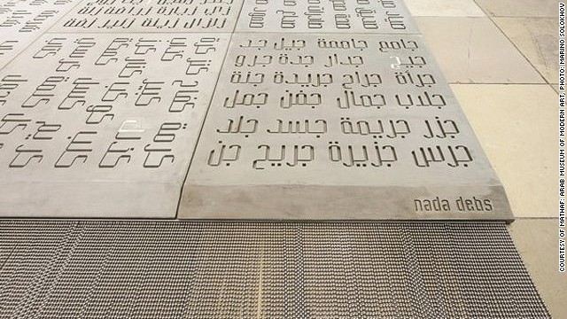 Japanese furniture and product designer Nada Debs blends Middle Eastern craftsmanship with Japanese minimalism. Her <i>Concrete Carpet </i>(detail)<i> </i>combines a light-weight form of concrete with Arabic font design. 