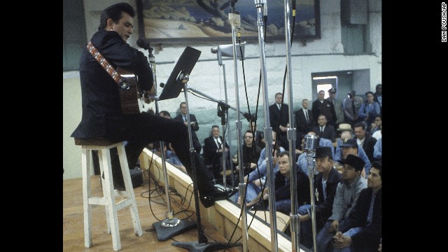 Cash performs for prisoners at Folsom Prison in California on January 13, 1968. The performance was recorded for his live album "Johnny Cash at Folsom Prison." 