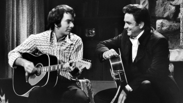 Cash, right, and Neil Diamond appear on "The Johnny Cash Show" aired on February 11, 1970.