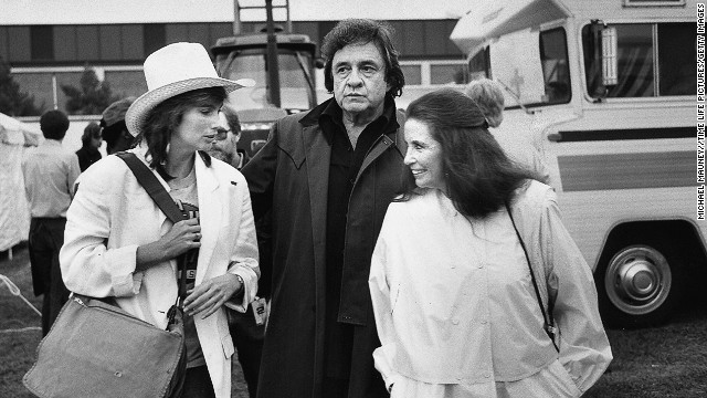 Emmylou Harris, from left, Johnny Cash and June Carter Cash chat at the Farm Aid Concert in Illinois in 1985.