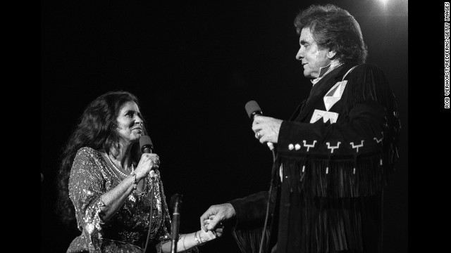 June Carter Cash and Johnny Cash perform on September 3, 1987.