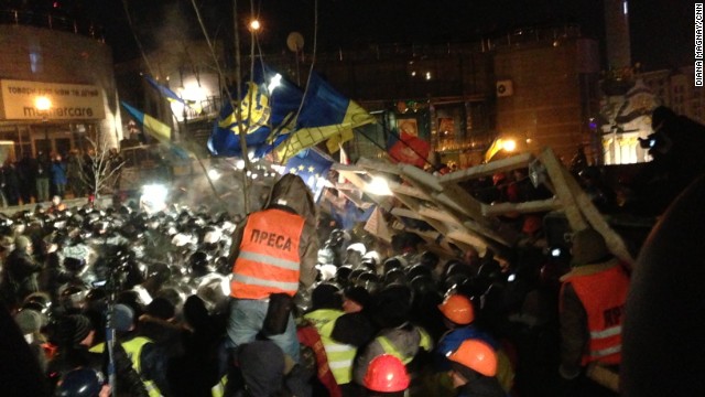 KIEV, UKRAINE: Ukrainian riot police storm barricades set up by pro-European Union protesters in Independence Square on December 11. Ukrainian security forces stormed the square, which protesters have occupied for three weeks. The demonstrators defiantly refused to leave and resisted the police in a tense standoff. Photo by CNN's Diana Magnay.