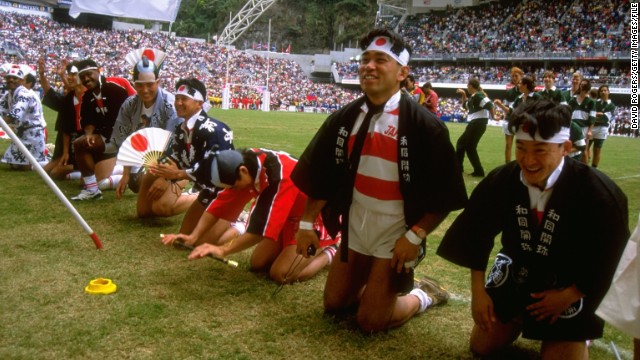 It's not always the fans who enforce the fancy dress code. In this image, Japanese players salute the crowd at the Hong Kong Rugby Sevens in 1990.
