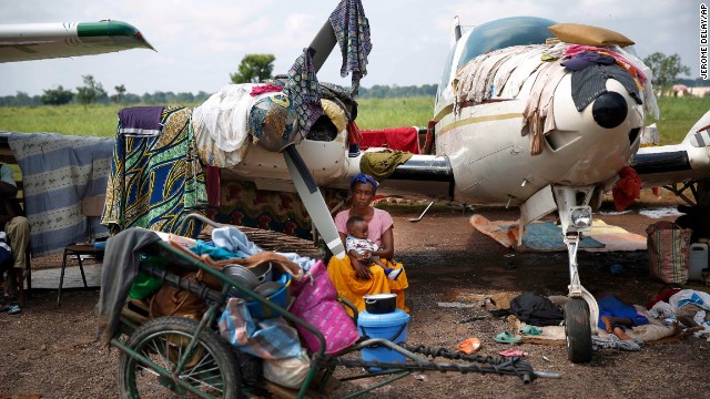 Christians gather in a makeshift camp for internally displaced people set in the airport in Bangui on Friday Dececember 13. 