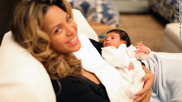 In this undated image released by Beyonce.com, Beyonce Knowles holds her daughter Blue Ivy in a recent family photo. A hand-written note accompanying the photos reads, "We welcome you to share our joy." 