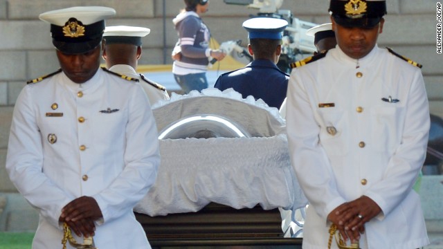 South African Naval personnel stand guard around Mandela's casket as he is carried to the Union Buildings on the final day of his lying in state on December 13.