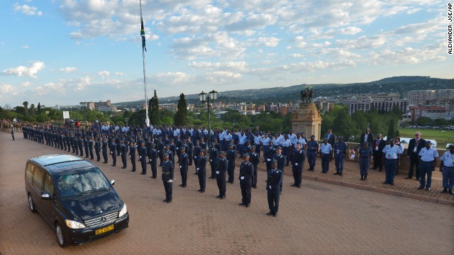 The hearse carrying former South African President Nelson Mandela leaves the Union Buildings after the final day of his lying in state in Pretoria, South Africa, on Friday, December 13.