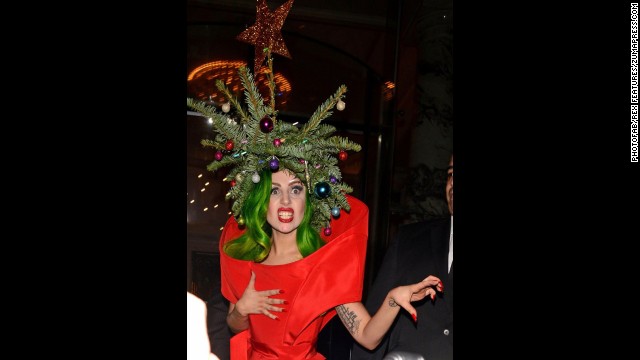 Pop singer Lady Gaga wears a real Christmas tree as a hat while returning to her hotel following the Jingle Bell Ball at London's O2 Arena on December 9.