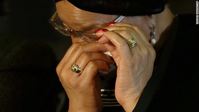 Mandela's widow, Graca Machel, wipes her eyes during the farewell ceremony for her husband.
