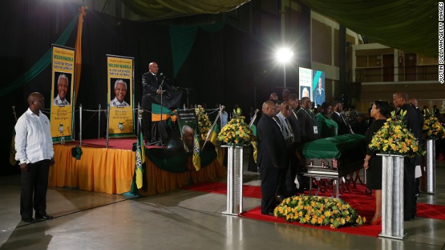 South African President Jacob Zuma speaks during an African National Congress-led alliance send-off ceremony at Waterkloof air base in Pretoria before the final journey of Mandela's body to his hometown of Qunu for burial.