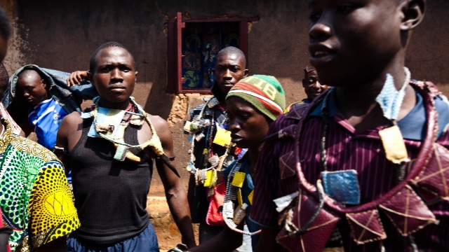 Anti-Balaka fighters, members of a militia opposed to the Seleka rebel group, pose with weapons and amulets in a village in the Boy-Rabe neighborhood in Bangui on December 14.