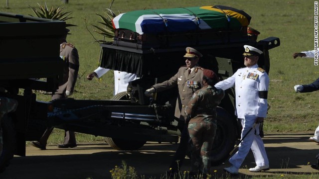 Mandela's casket is escorted to the funeral ceremony on December 15.