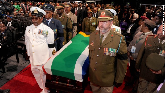 Mandela's casket is escorted inside for the funeral ceremony.