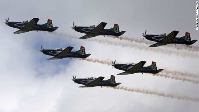 Planes fly overhead during the burial.