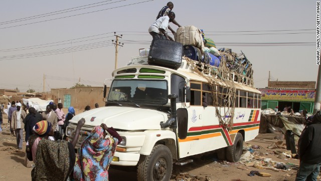 South Sudanese pack their belongings on a bus before their trip back to the South in Khartoum on Saturday.