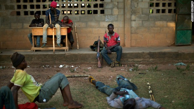 Former soldiers linked to Christian militiamen rest Sunday, December 15, in a camp set up in a Bangui school. Christian vigilante groups formed to battle Seleka, the predominantly Muslim coalition behind the March removal of President Francois Bozize.