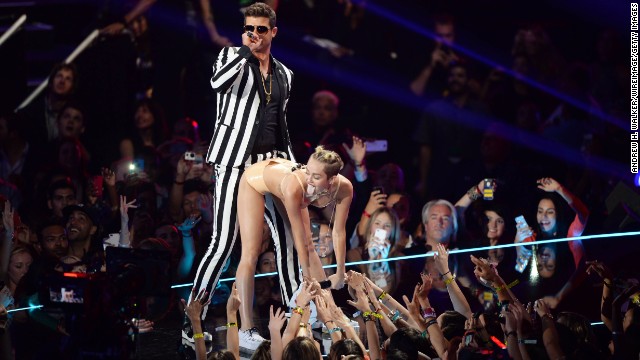 Oh 2013, you were something else. Let's take a<a href='http://www.cnn.com/2013/08/26/showbiz/music/miley-cyrus-mtv-vmas-gaga/'> twerk.</a>..er, look back at the year in pop culture, which gave us such amazing moments as this one of Robin Thicke and Miley Cyrus performing onstage during the 2013 MTV Video Music Awards at the Barclays Center in August 2013...