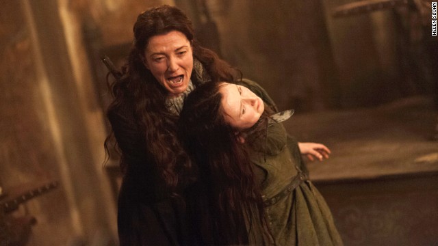 Catelyn Stark (Michelle Fairley) seizes Walder Frey's wife (Kelly Long) in an episode of 