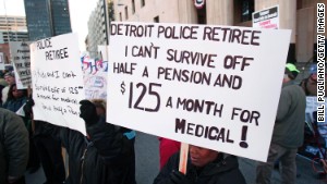 Retired city workers protest in front of the U.S. Courthouse where a judge ruled that Detroit is eligible to file for bankruptcy.\n