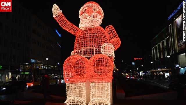 Berlin lights up during Christmas time, and there are markets and Christmas displays around every corner. iReporter <a href='http://ireport.cnn.com/docs/DOC-1068984' target='_blank'>markpel</a> took this photo of a giant Santa Claus in the western inner city, close to the famous luxury department store KaDeWe.