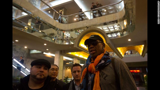 Rodman attracts notice as he enters the Koryo Hotel in Pyongyang on Thursday, December 19. 