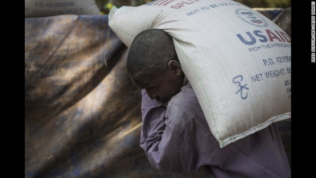 A man carries a bag of food at a Christian refugee camp in Bossangoa, Central African Republic, on December 19.