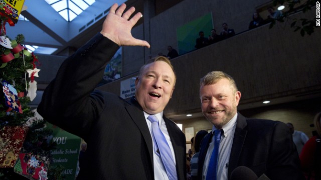 Utah state Sen. Jim Dabakis, left, and Stephen Justesen acknowledge the crowd after being married in Salt Lake City on Friday, December 20. A federal judge struck down Utah's ban on same-sex marriage, saying it conflicted with the constitutional guarantees of equal protection and due process. Many Utah counties began issuing marriage licenses before the state appealed to the U.S. Supreme Court. The high court temporarily blocked enforcement of the lower court ruling until the constitutional questions were fully resolved.