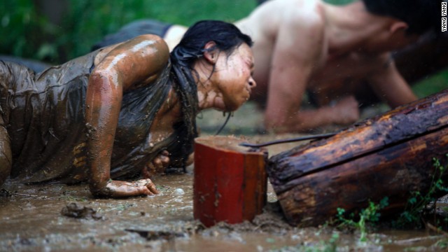 Trainees must crawl through mud and undergo other endurance training.