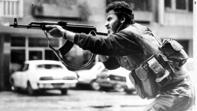 A Shiite Muslim militiaman fires his AK-47 during a battle in West Beirut, Lebanon, in 1987.