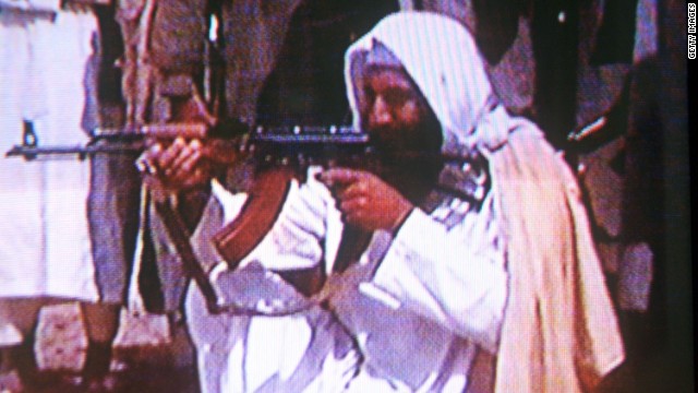 Osama bin Laden fires an AK-47 in this still frame from the infamous video of him released after September 11, 2001.