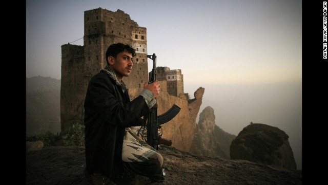 A man guards the the village of Jebel Shugruf in the Haraz Mountains of Yemen in 2006.