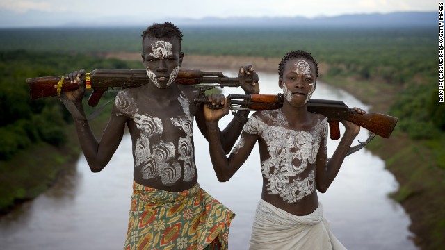 Members of the Karo Tribe pose with AK-47s in Korcho, Ethiopia, in 2008.